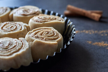 cinnamon rolls against a dark Background