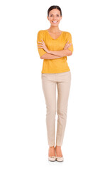 A casually dressed young woman standing with her arms folded isolated on a PNG background.