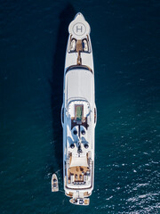 bird's eye drone view of luxury yacht in the sea