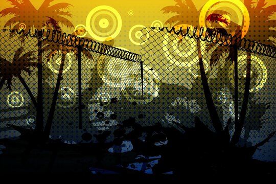 Barbed wire over silhouette of palm trees against yellow background