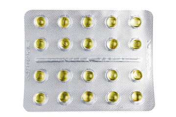 Yellow capsules in a blister pack isolated on transparent background, top view, healthcare and medicine concept