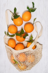 String bag with fresh oranges