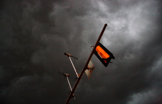 Oblique View Of A Trafficlight Against A Stormy Sky.