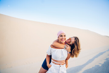 Young woman with pink headscarf fighting cancer together with her friend.