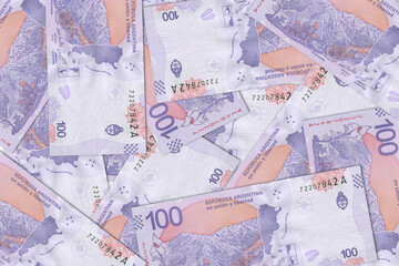 The Argentine currency - Argentine peso. Macro view of Argentina paper money. Close-up Argentine...