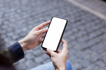 cell phone blank white screen mockup.hand holding texting using mobile on desk at office.background empty space for advertise.work people contact marketing business,technology