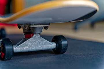 Close-up of metal axis and wheels of skateboard at home at City of Zürich. Photo taken January 26th, 2023, Zurich, Switzerland.