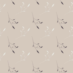 Seamless pattern of foliage branches in grey and brown on a beige background
