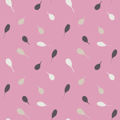 Seamless pattern of scattered leaves on a pink background
