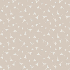 Seamless ditsy pattern of small flowers or leaves on a beigh backchourn
