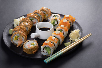 sushi chef preparing sushi rolls