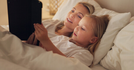 Obraz na płótnie Canvas Tablet, bed and relax with a girl and mother watching or streaming series on a subscription service while lying in a bedroom. Family, love and kids with a woman and daughter bonding together at home