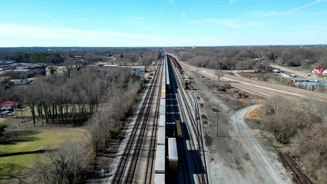 Long straight Railroad track with Train and cars in Salisbury, NC