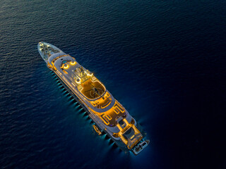 night drone view of luxury yacht in the sea