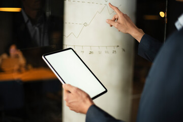 Close up of man using digital tablet