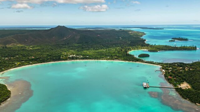 Aerial parallax, time lapse over Kuto Bay, Ise of Pines, N'ga Peak in background.