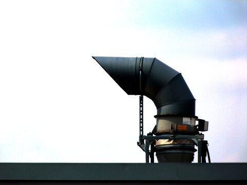 Goose Neck Duct And Mechanical Vent Or Exhaust Pipe. Roof Top With Ties And Braces And Metal Parapet Flashing. Closeup View. Building Mechanics And Construction Concept.