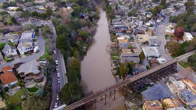 Aftermath of extreme storm in Capitola, California. High river water levels and dense traffic on the coastline