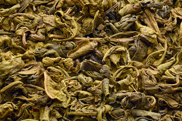 Organic Chinese green tea with large leaves for making traditional Asian hot flavored drink, basis of healthy eating and vegetarianism