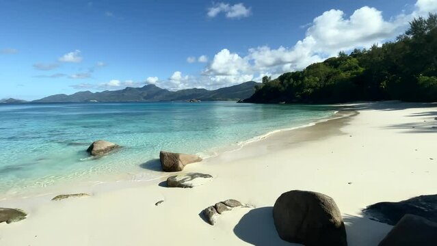 Mahe Seychelles beautiful white sandy beach, calm sea sunny day,and no people