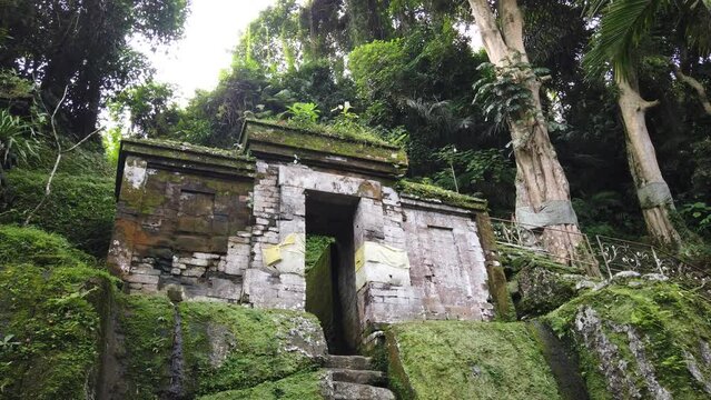 Balinese Ancient Temple Goa Garba, Old Stone Stairs and Gate, Moss on Archaeological Hindu Place, Travel and Tourism Bali, Indonesia