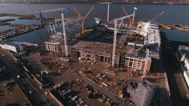 Slow pull back reveal of construction underway at Everton Football Club new stadium