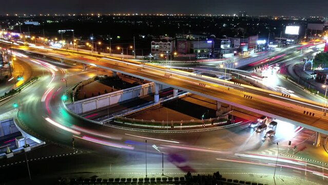 Traffic an important infrastructure, financial technology, Expressway top view, traffic transportation above intersection road in city night sky aerial view cityscape of advanced innovation,Hyperlapse