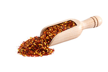 Dried pepperoni pepper on wooden measuring spoon. Isolated on white background for clipping. Without shadow