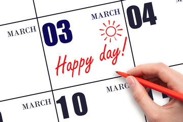 Hand writing the text HAPPY DAY and drawing the sun on the calendar date March 3