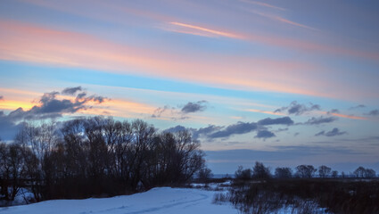 Winter Evening Sky with Pink and Purple Clouds in Countryside