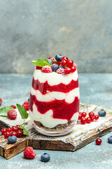 Scottish dessert whipped cream, roasted oatmeal and raspberries in jar. banner, menu, recipe place for text, top view