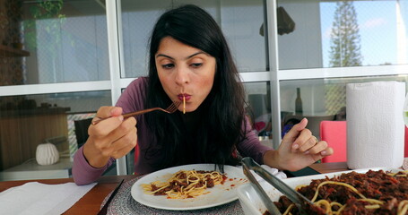 Woman eating pasta spaghetti for lunch