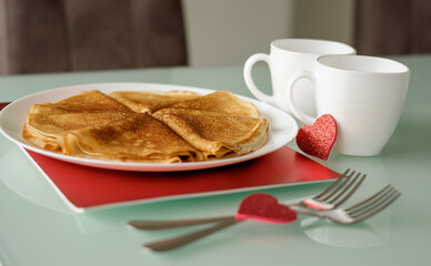 Idea for Valentine's Day surprise gift. Cute pancakes crepes with coffee or tea. Romantic valentine breakfast.