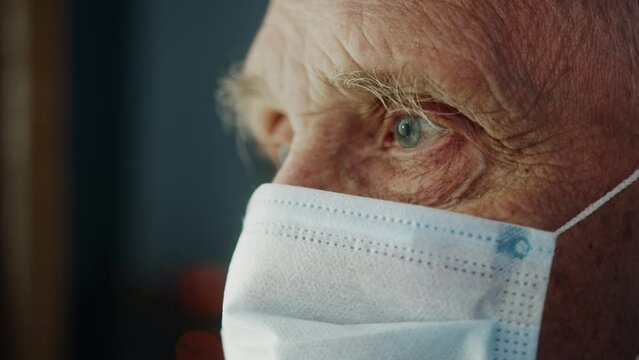 Portrait Of Elderly Old Man With Short White Hair, Wearing Face Medical Mask For Protection Virus, Coronavirus Covid 19. Health Care Concept, American Grandfather Grandpa Senior Male Home Near Window