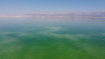 Dead Sea beautiful water warm weather with clear blue sky. Aerial footage taken by a drone
 