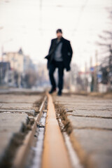 person walking on the railway