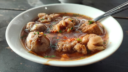 a bowl of spicy meatballs