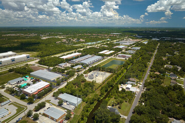 Aerial view of industrial park with goods warehouses and logistics centers in city zone from above