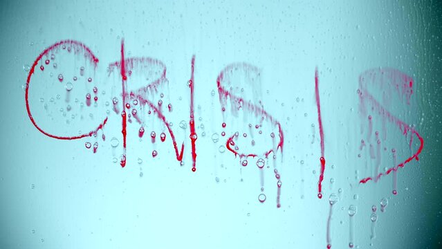 A crisis word recovering on a glass screen. Reverse video of paint inside a jar with water. High quality 4k footage