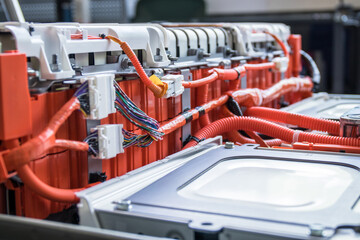 Close up look at the inner workings of an electric car's high-voltage battery with this detailed photo. See cells, wiring, heating system, connectors, and power buses. 
