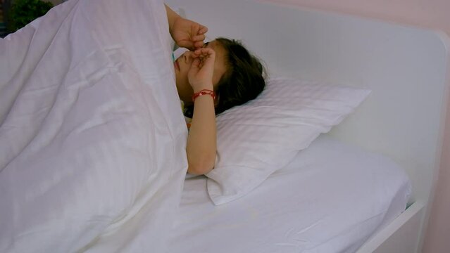 The tooth fairy brought money under the pillow to the child. selective focus.