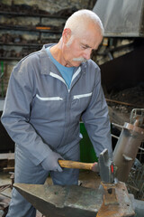 portrait of man senior worker with tools