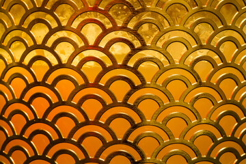 Abstract graphic of tessellating metallic golden scales style graphic. Background.