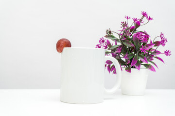 A white blank coffee mug with a grape decorated to the edge of the mug, minimalist fresh concept