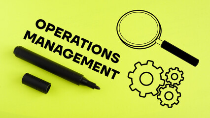 Fototapeta Operations Management is shown using the text and picture of gears obraz