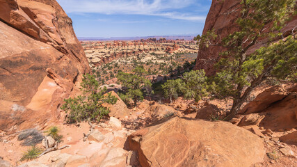 hiking the chesler park loop trail in the needles in canyonlands national park, usa