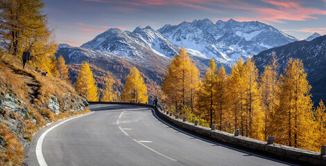 Amazing nature autumn landscape. Asphalt road in Austria, Alps in a beautiful summer day. Summer view of Asphalt road Grossglockner High Alpine Road. Picture of wild area. Active recreation concept