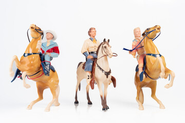 Obraz premium Vintage Toy Cowgirl and Cowboy Riders Group