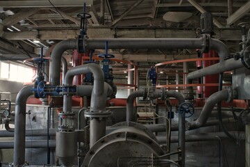 Steel pipes, tubes, steam turbine, valves, machinery, cables of modern factory. Gas boiler room of industrial zone power plant. Pump engineering station. Technical equipment system. Energy concept.