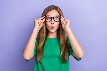 Naklejka premium Photo of astonished cute lady wear trendy clothes hand touch glasses impressed quality new accessory isolated on purple color background